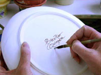 Each piece of HB Henriot Quimper pottery is signed on the back by the artist prior to the firing.